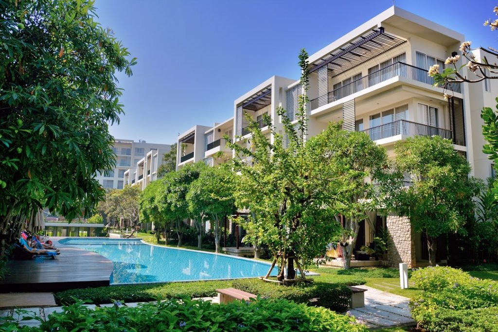 green-trees-near-swimming-pool-during-daytime-ni4ac1katrc